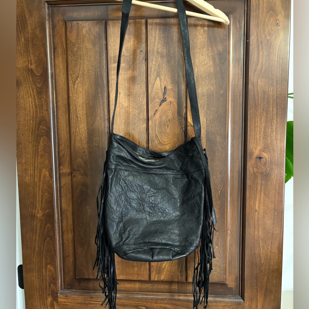 Cleobella black fringe leather purse.